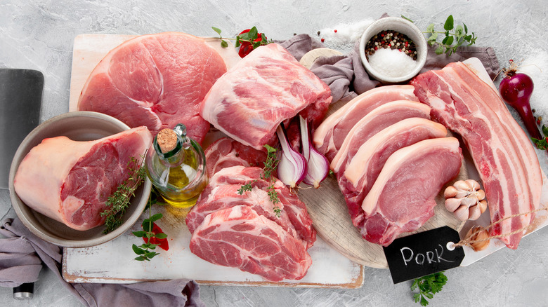 assortment,of,raw,pork,meat,on,light,grey,background.,organic assortment,of,raw,pork,meat,on,light,grey,background.,organic